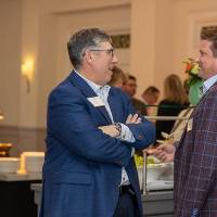 Dan Hurwitz talking with event guest